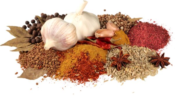 A pile of spices and garlic on top of each other.