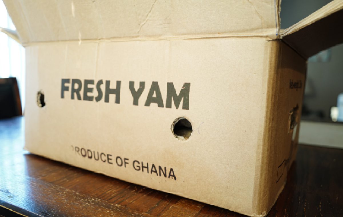 A box that says fresh yam produce of ghana.