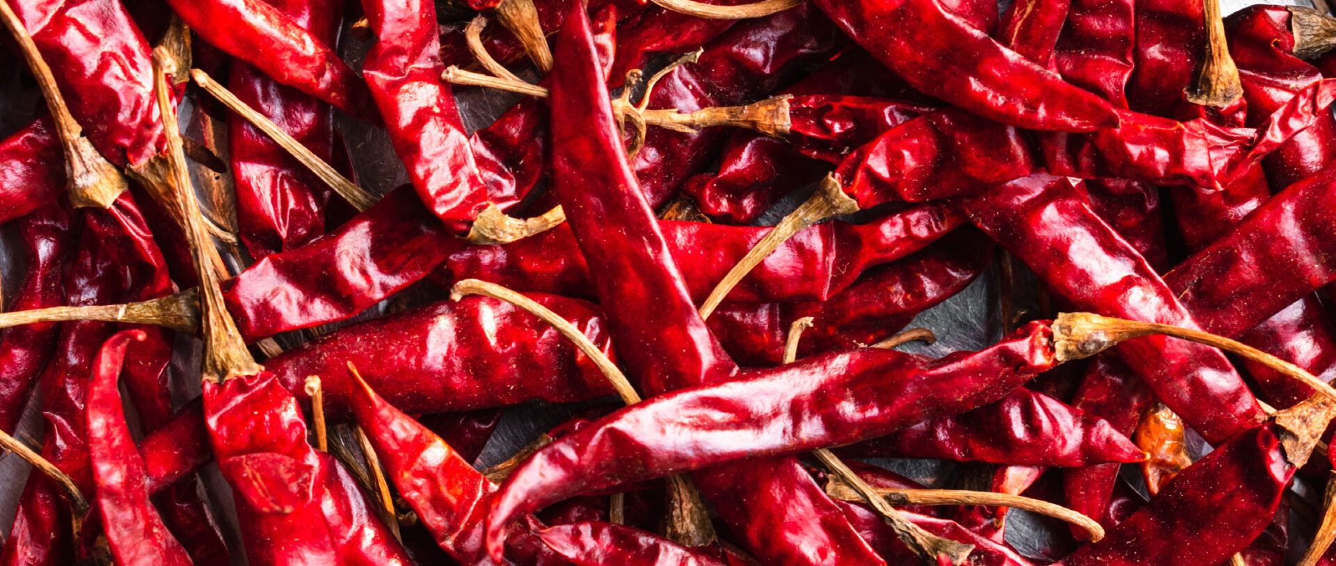 A close up of red peppers on the ground